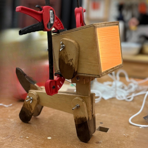 Finished wooden dog lamp with LED light installed.