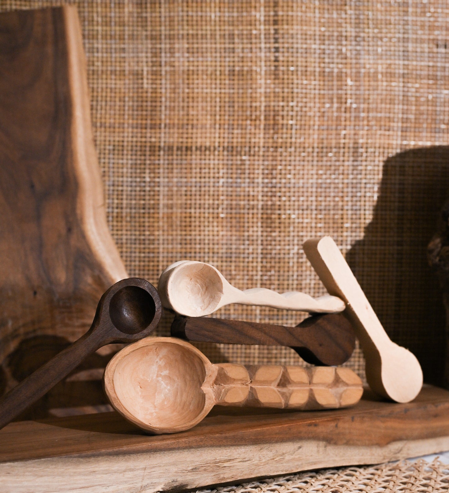 Finished hand-carved wooden spoons displayed on a table, showing the final result of the Spoon Carving Kit activity.